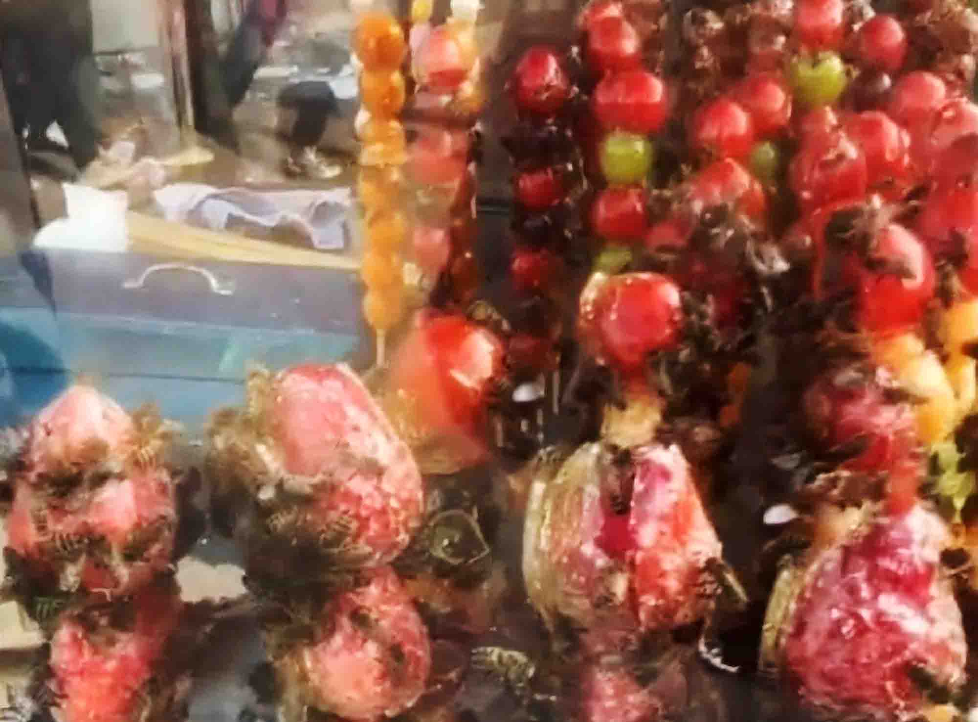 Street Vendor Relocates After Bee Swarm Feasts On Candied Fruit